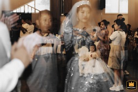 LanKao, China: A bride, groom, and the bride's father wait together moments before the wedding ceremony begins in LanKao, China.